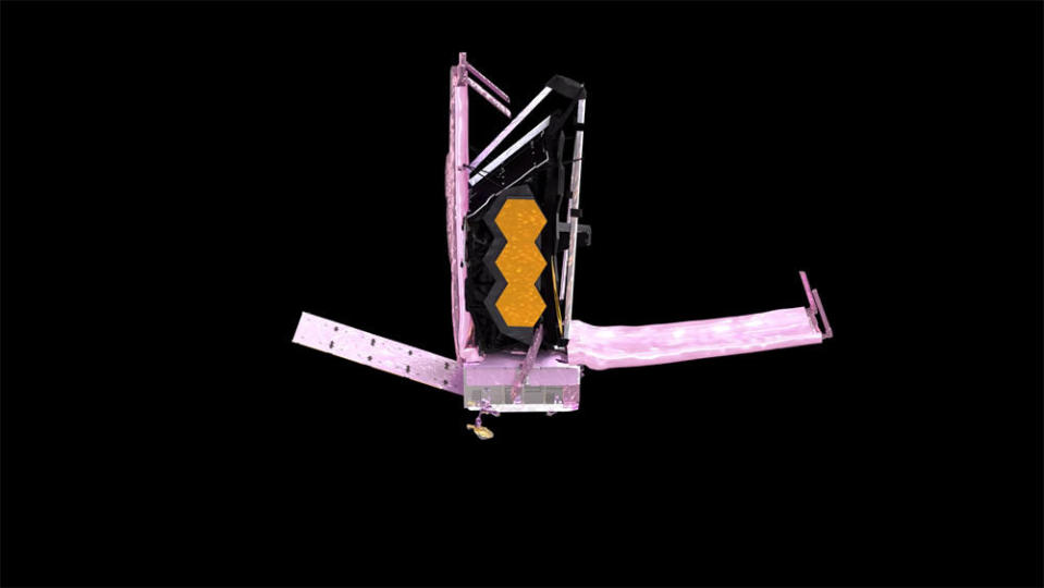 With Webb's single solar panel already deployed to the left, the telescope's forward sunshade pallet was unfolded to the right Tuesday to kick off a multi-day procedure to unfurl its still-folded-up sunshield. / Credit: NASA