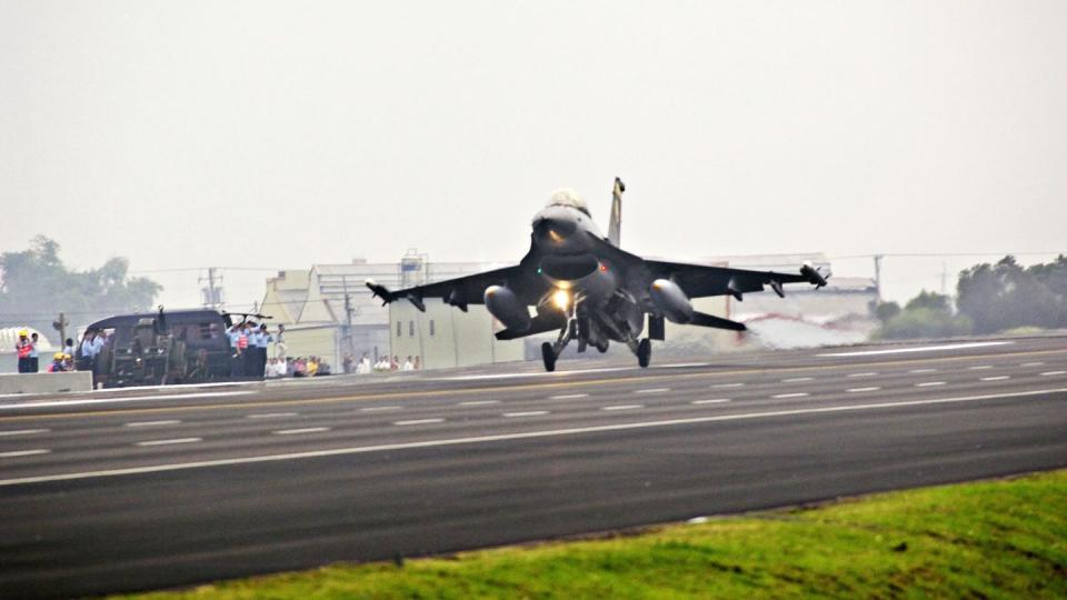 an f16 fighter of the taiwan air force lands on a stretch of freeway