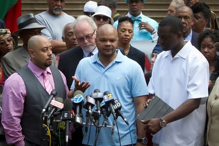 FILE PHOTO: Wrongly convicted "Central Park Five" members Santana, Richardson and Salaam attend a news conference announcing the payout for the case at City Hall in New York