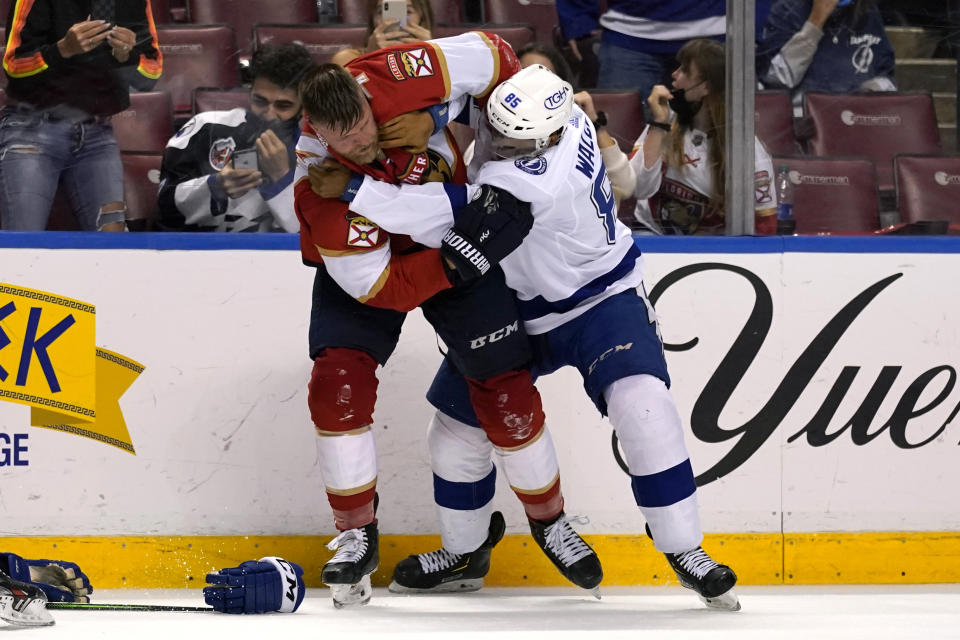 Florida Panthers defenseman Kevin Connauton, left, and Tampa Bay Lightning defenseman Daniel Walcott (85) fight during the second period of an NHL hockey game, Monday, May 10, 2021, in Sunrise, Fla. (AP Photo/Lynne Sladky)