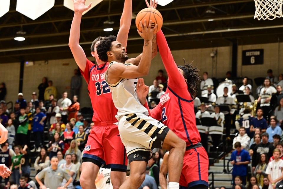 Bryant's Sherif Gross-Bullock goes to the hoop against Stony Brook during Friday night's game at the Chase Center.