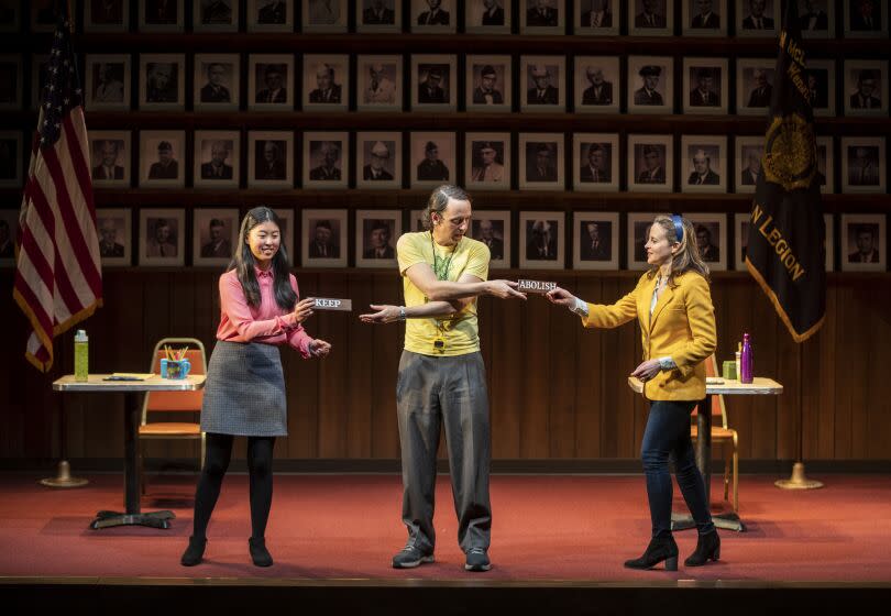 LOS ANGELES, CALIF. -- FRIDAY, JANUARY 10, 2020: High school student Jocelyn Shek, left, performs with actors Maria Dizzia, right, and Mike Iveson, center, on stage in "What the Constitution Means to Me" during dress rehearsal at the Mark Taper Forum in Los Angeles, Calif., on Jan. 10, 2020. (Brian van der Brug / Los Angeles Times)