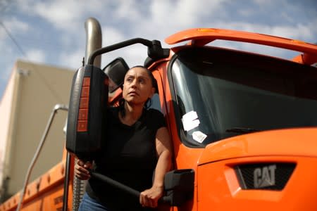 Sandra Alzate, 51, vice president of a trucking company, poses for a portrait in Los Angeles