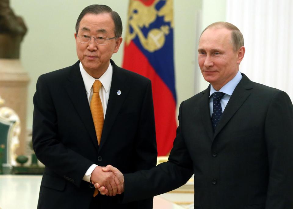 Visiting United Nations Secretary General Ban Ki-moon, left, shakes hands with Russian President Vladimir Putin during their meeting in Moscow's Kremlin, Russia, Thursday, March 20, 2014. (AP Photo/ Sergei Ilnitsky, pool)