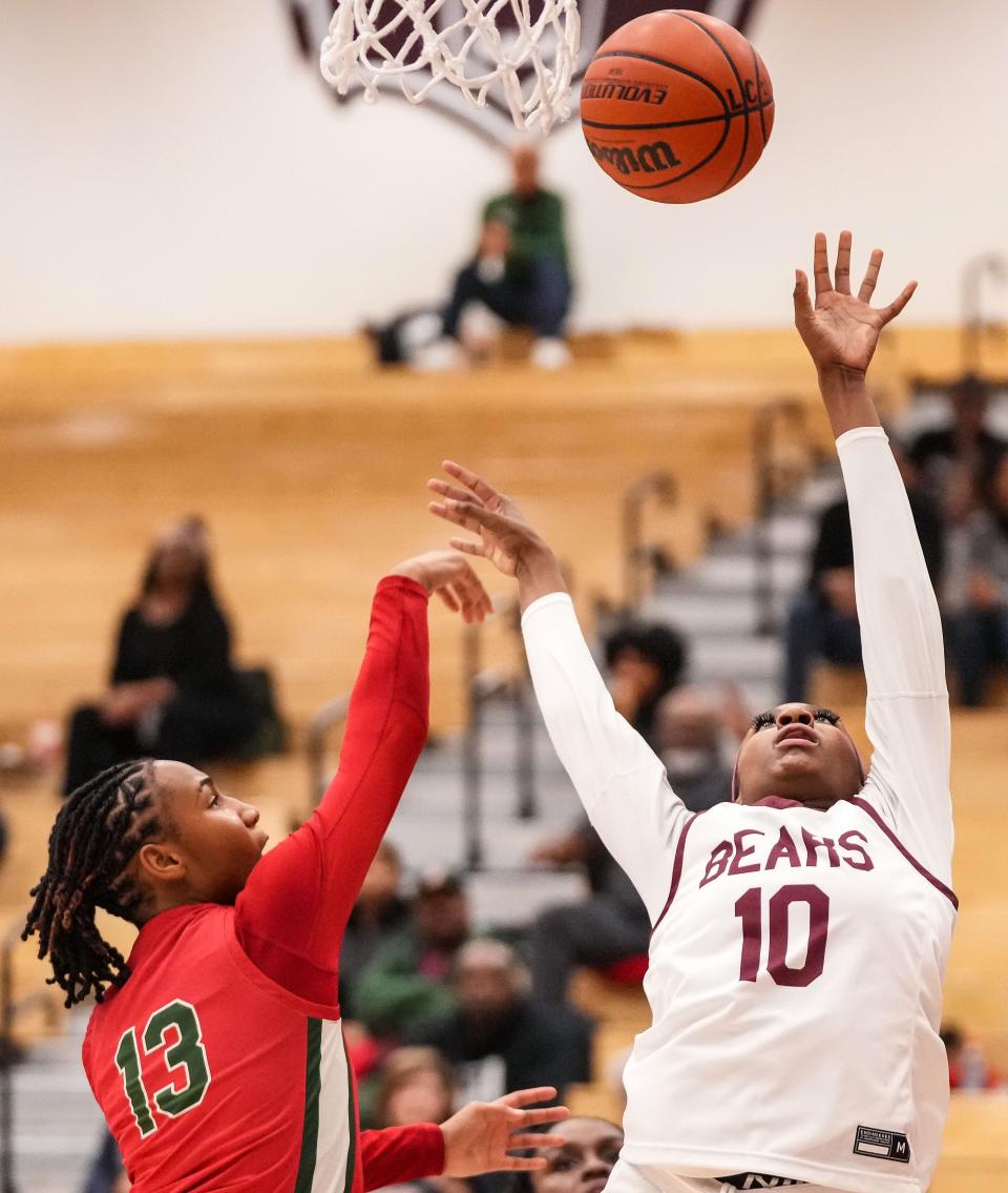 Lawrence Central Bears guard Jaylah Lampley (10) attempts to recover a rebound from Lawrence North Wildcats Naja Winston (13) on Thursday, Dec. 7, 2023, during the game at Lawrence Central High School in Indianapolis. The Lawrence Central Bears defeated the Lawrence North Wildcats, 57-55.