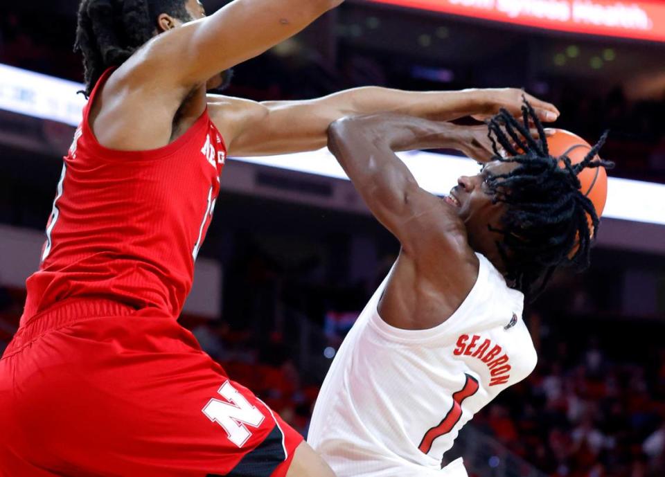 N.C. State’s Dereon Seabron (1) shoots while Nebraska’s Derrick Walker (13) defends during the first half of N.C. State’s game against Nebraska at PNC Arena in Raleigh, N.C., Wednesday, December 1, 2021.