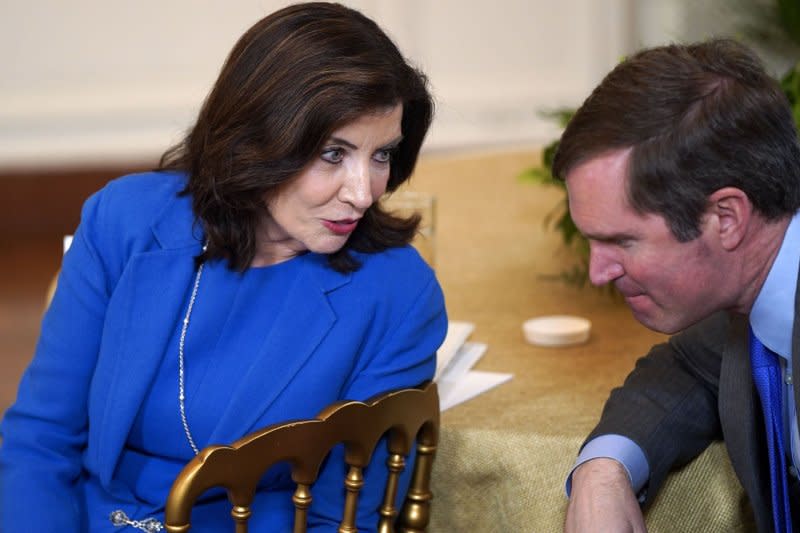 Democratic New York Gov. Kathy Hochul speaks with Democratic Kentucky Gov. Andy Beshear during the National Governors Association Winter Meeting in the East Room of the White House on Friday. Photo by Leigh Vogel/UPI