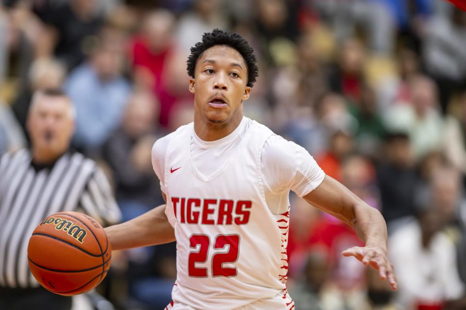 Fishers High School junior JonAnthony Hall (22) brings the ball up court during the first half of a game in the Forum Tipoff Classic against Kokomo High School, Saturday, Dec. 9, 2023, at Southport High School.