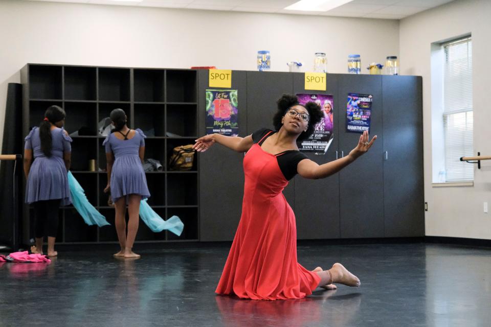 Students in the Tuscaloosa Fine Arts Academy at Paul W. Bryant High School rehearse for their roles in the Tuscaloosa Symphony Orchestra's annual young people's concert "Give Me Space." Jala Poke rehearses a number that will be a duet when danced at the Sunday concert.