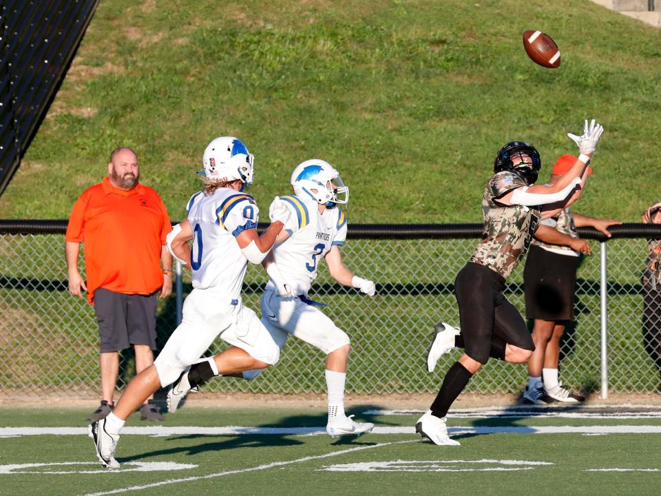 Tatem Toth catches a pass during New Lexington's 38-18 win against visiting Maysville on Friday night at Jim Rockwelll Stadium.