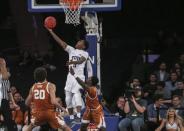 Apr 2, 2019; New York, NY, USA; Texas Christian Horned Frogs guard Kendric Davis (5) shoots a reverse layup against the Texas Longhorns in the second half of the NIT semifinals at Madison Square Garden. Mandatory Credit: Wendell Cruz-USA TODAY Sports