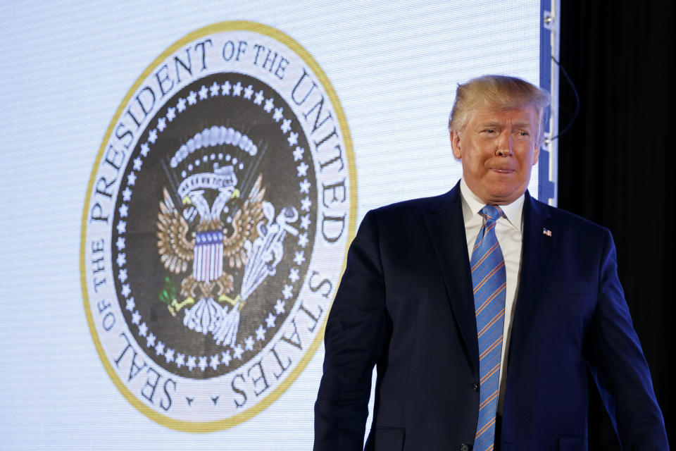 President Donald Trump arrives to speak, with an altered presidential seal behind him, at Turning Point USA's Teen Student Action Summit 2019, Tuesday, July 23, 2019, in Washington. (AP Photo/Alex Brandon)