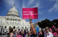 Healthcare activists with Planned Parenthood and the Center for American Progress protest in opposition to the Senate Republican healthcare bill on Capitol Hill in Washington, June 28, 2017. REUTERS/Joshua Roberts/Files