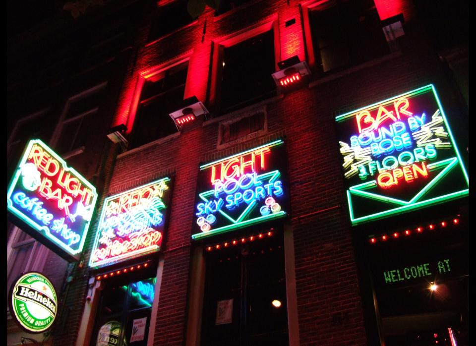 In the Netherlands, prostitution is legal, as are brothels. Because of the size of the industry, the government has attempted to scale it back in recent years, and a law has been proposed to ban women under the age of 21 from the business. <i>Red Light Bar in Amsterdam</i> (Photo courtesy of <a href="http://www.flickr.com/photos/bensutherland/" target="_hplink">Flickr/Ben Sutherland</a>)