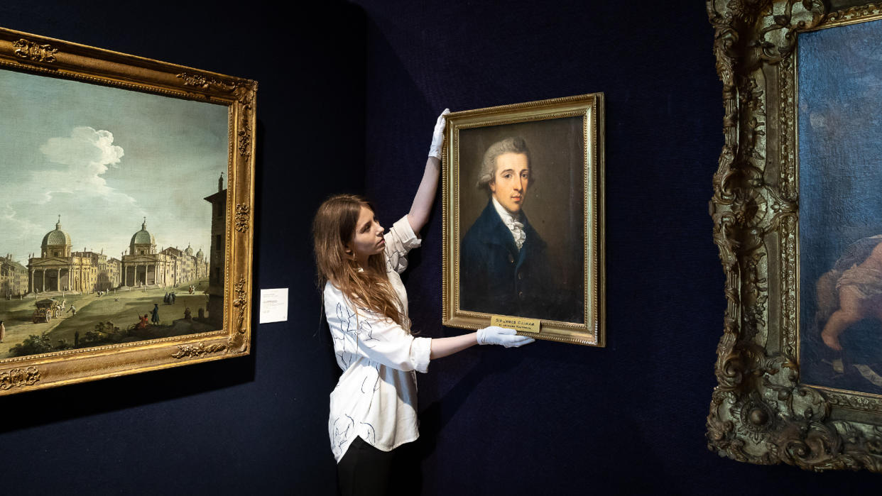  A Kauffman portrait is adjusted during a 2021 Bonhams sale. 