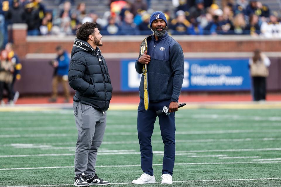 Former Michigan running back Blake Corum, left, talks with former defensive back Charles Woodson during the spring game at Michigan Stadium in Ann Arbor on Saturday, April 20, 2024.