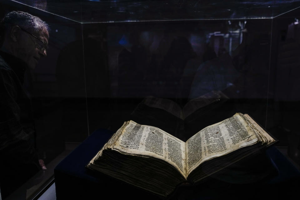 The Codex Sassoon 1,100-year-old Hebrew Bible is on display at the Tel Aviv's ANU Museum of the Jewish People for a week-long exhibition of the manuscript, part of a whirlwind worldwide tour of the artifact in the United Kingdom, Israel and the United States before its expected sale, Israel, Wednesday, March 22, 2023. One of the oldest surviving biblical manuscripts is up for sale — for a cool $30 million. The Codex Sassoon is a nearly complete 1,100-year-old Hebrew Bible. Sotheby's is putting it up for auction in New York in May for an estimated price of $30 million to $50 million. (AP Photo/Ariel Schalit)