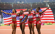 Carmelita Jeter of the United States, Bianca Knight of the United States, Allyson Felix of the United States and Tianna Madison of the United States celebrate after winning gold and setting a new world record of 40.82 afterthe Women's 4 x 100m Relay Final on Day 14 of the London 2012 Olympic Games at Olympic Stadium on August 10, 2012 in London, England. (Photo by Alex Livesey/Getty Images)