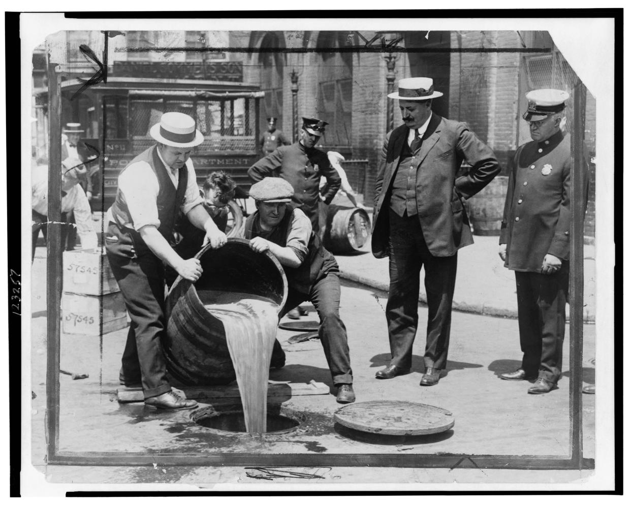 Authorities dumping alcohol during Prohibition