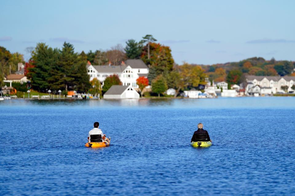 People pedal kayak on Lake Hopatcong on Thursday, Oct. 28, 2021.