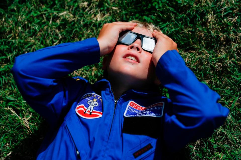 PHOTO: Tyler Hanson, of Fort Rucker, Ala., watches the sun moments before the total eclipse, Aug. 21, 2017, in Nashville, Tenn. (John Minchillo/AP, FILE)