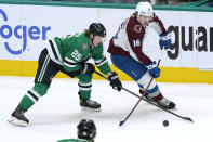 Colorado Avalanche right wing Nicolas Aube-Kubel (16) and Dallas Stars left wing Joel Kiviranta (25) skate for control of the puck during the first period of an NHL hockey game in Dallas, Friday, Nov. 26, 2021. (AP Photo/LM Otero)