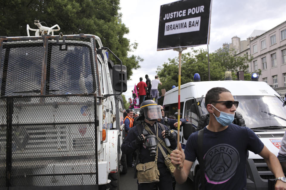 People march during a protest in Paris, Saturday, June 20, 2020. Multiple protests are taking place in France on Saturday against police brutality and racial injustice, amid weeks of global anger unleashed by George Floyd's death in the US. (AP Photo/Rafael Yaghobzadeh)