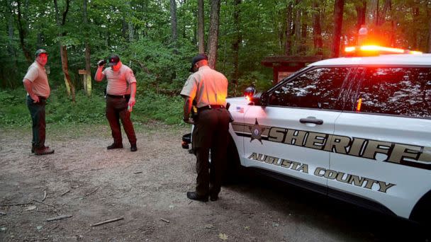 PHOTO: Authorities secure the entrance to Mine Bank Trail, an access point to the rescue operation along the Blue Ridge Parkway where a Cessna Citation crashed over mountainous terrain near Montebello, Va., Sunday, June 4, 2023 (Randall K. Wolf via AP)