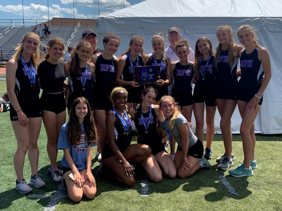 The Rumson-Fair Haven girls track team with the Central Group 2 trophy