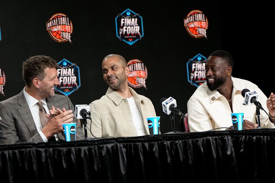 Dirk Nowitzki, from left, Tony Parker and Dwyane Wade talk during a news conference for the The Naismith Basketball Hall of Fame at the NCAA college basketball Tournament on Saturday, April 1, 2023, in Houston. (AP Photo/David J. Phillip)