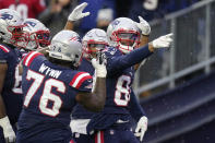 New England Patriots wide receiver Kendrick Bourne, right, is congratulated after his touchdown during the second half of an NFL football game against the Tennessee Titans, Sunday, Nov. 28, 2021, in Foxborough, Mass. (AP Photo/Steven Senne)