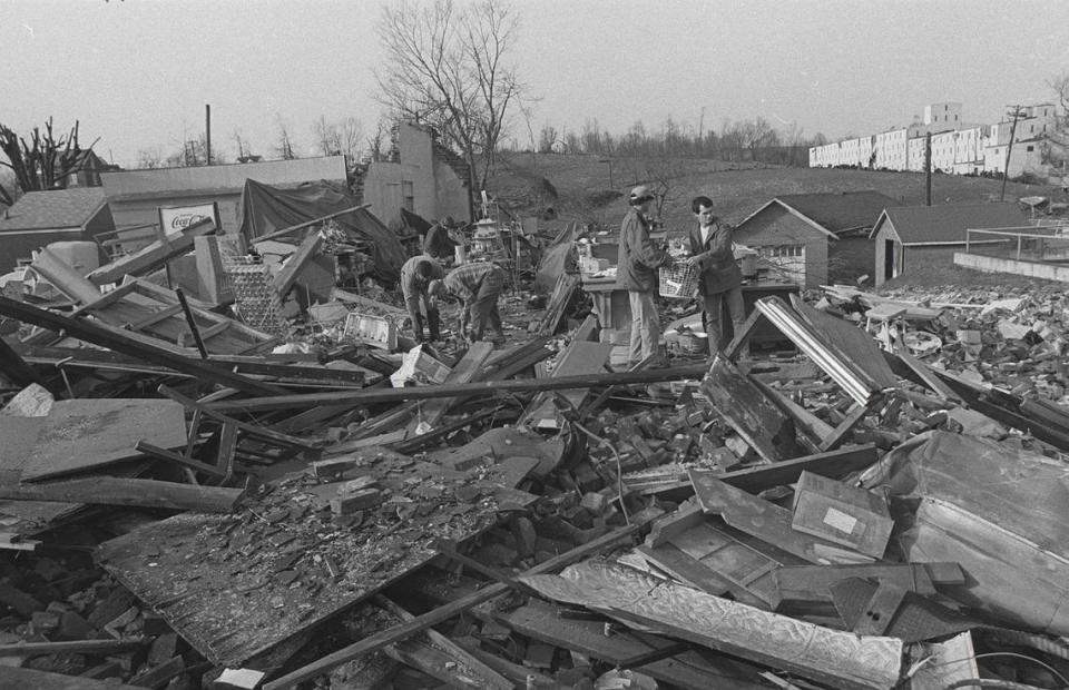 Residents and volunteers help search for possessions to salvage from a building in Stamping Ground, Ky., after much of the town was leveled by a tornado Wednesday April 4, 1974.