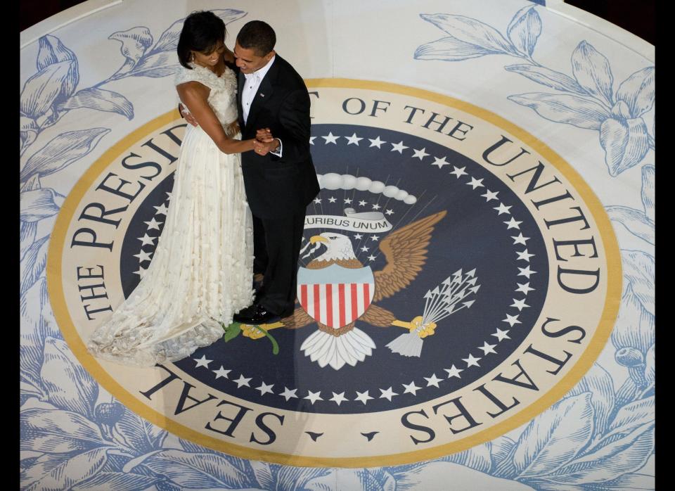 US President Barack Obama and First Lady Michelle Obama dance during the Commander-in-Chief Ball at the National Building Museum in Washington, DC, January 20, 2009. Obama was sworn in as the 44th US president earlier in the day. AFP PHOTO / Saul LOEB (Photo credit should read SAUL LOEB/AFP/Getty Images)