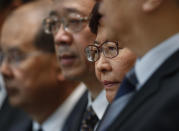 Hong Kong Chief Executive Carrie Lam listens to reporters questions during a press conference in Hong Kong Monday, July 22, 2019. Hong Kong leader Carrie Lam denies that police colluded with the masked assailants who indiscriminately attacked residents in a subway station. Lam called "unfounded" allegations that the police were working together with the Yuen Long station assailants, who beat people Sunday evening using steel pipes and wooden poles. (AP Photo/Vincent Yu)