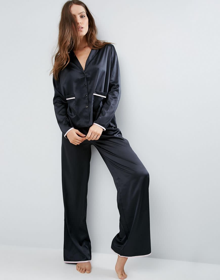 <p><a rel="nofollow noopener" href="http://www.asos.com/asos/asos-christy-satin-long-leg-pyjama-set/prd/7044599?iid=7044599&clr=Black&SearchQuery=&cid=6578&pgesize=204&pge=0&totalstyles=688&gridsize=3&gridrow=63&gridcolumn=2" target="_blank" data-ylk="slk:ASOS, £30;elm:context_link;itc:0;sec:content-canvas" class="link ">ASOS, £30</a> </p>