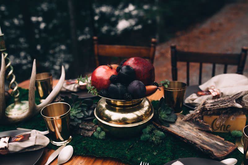 <p>This centerpiece can be created just minutes before a party, but it certainly doesn’t look like it. Gather deep-hued fruits—think plums and pomegranates—into a gold compote or serving dish and situate as a centerpiece when flowers just aren’t possible. It’s a jewel-toned, edible arrangement that looks natural on the Christmas dinner table. </p><p><em>Via <a href="http://junebugweddings.com/wedding-blog/winter-wedding-inspiration-quebec/" rel="nofollow noopener" target="_blank" data-ylk="slk:Junebug Weddings;elm:context_link;itc:0;sec:content-canvas" class="link ">Junebug Weddings</a></em></p>