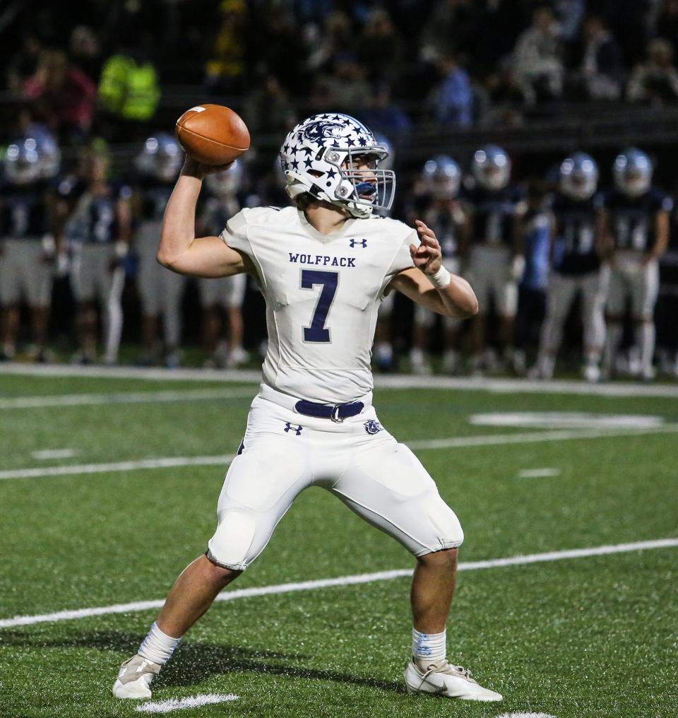 West Morris' John Rolli throws a pass during the first half of a football game at Sparta High School on September 23, 2022.