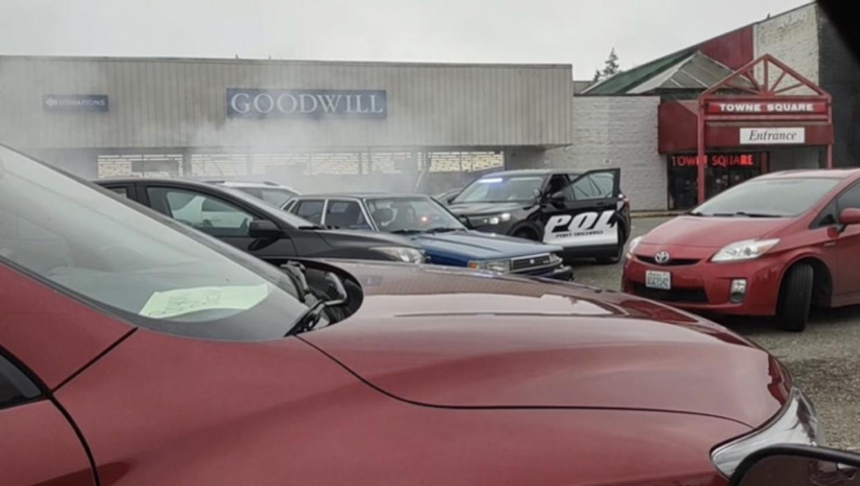 This still shot from video filmed in January by an unnamed bystander and shared on social media shows a suspected car thief repeatedly ram Port Orchard police cars before escaping.