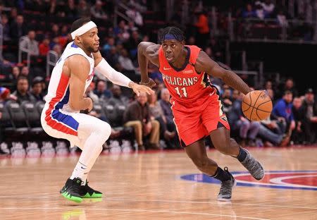 Dec 9, 2018; Detroit, MI, USA; New Orleans Pelicans guard Jrue Holiday (11) drives to the basket as Detroit Pistons guard Bruce Brown (6) defends during the first quarter at Little Caesars Arena. Tim Fuller-USA TODAY Sports