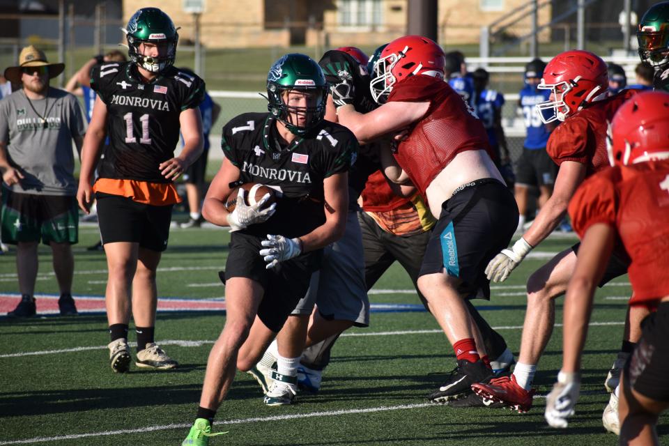 Monrovia's Dustin Kostrzewski (7) looks for a lane against the Martinsville defense during a four-team scrimmage with the Artesians, Heritage Christian and Lebanon on July 20, 2022.