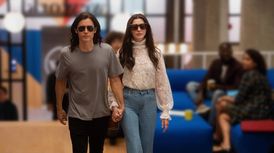 Jared Leto and Anne Hathaway walk through a WeWork