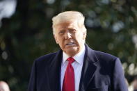 President Donald Trump speaks to the media before boarding Marine One on the South Lawn of the White House, Tuesday, Jan. 12, 2021 in Washington. The President is traveling to Texas. (AP Photo/Gerald Herbert)