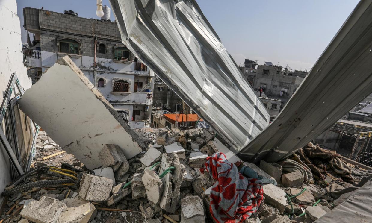 <span>A building belonging to a displaced family in Rafah on 16 April that was heavily damaged in an Israeli attack.</span><span>Photograph: Anadolu/Getty Images</span>