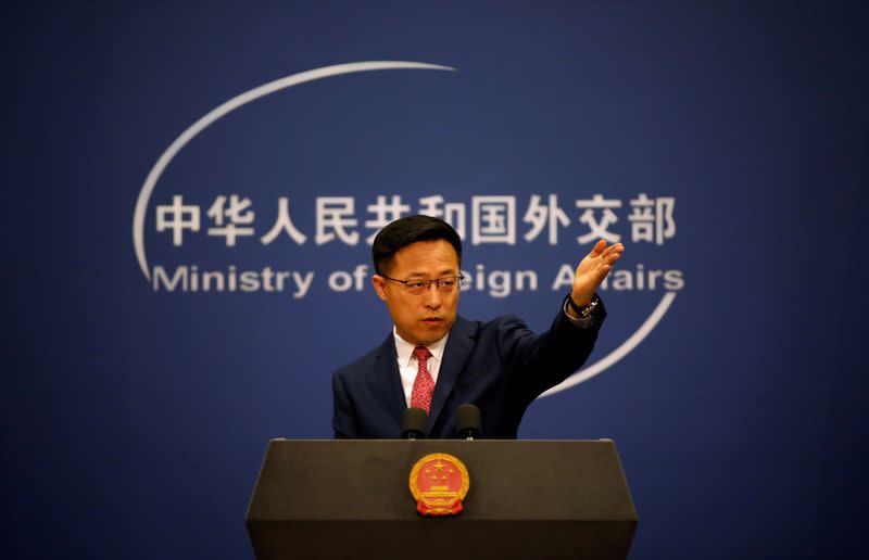 FILE PHOTO: Chinese Foreign Ministry spokesman Zhao Lijian attends a news conference in Beijing