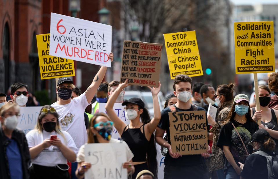 People rally against anti-Asian hate in Washington's Chinatown on March 27, 2021, after women were killed in a shooting rampage at massage parlors in the Atlanta area.