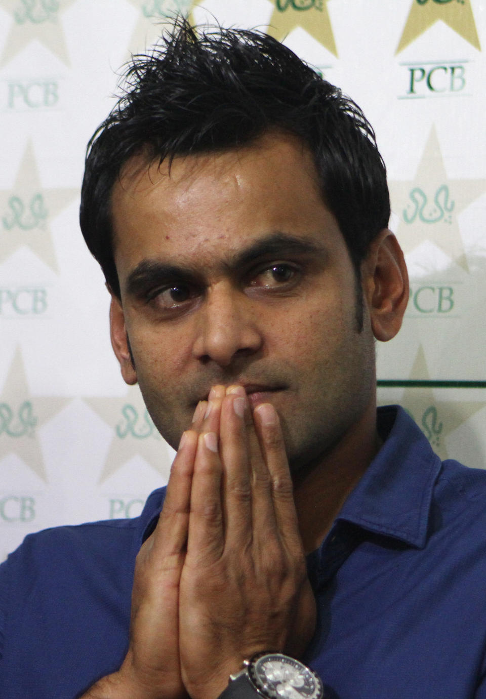 Pakistan Twenty20 captain Mohammad Hafeez listens to a reporter during a news conference in Lahore, Pakistan, Wednesday, March 12, 2014. Hafeez hoped Shahid Afridi gets fit in time to play in World Twenty20 after hard-hitting allrounder delayed his departure to Bangladesh to recover from hamstring injury. (AP Photo/K.M. Chaudary)