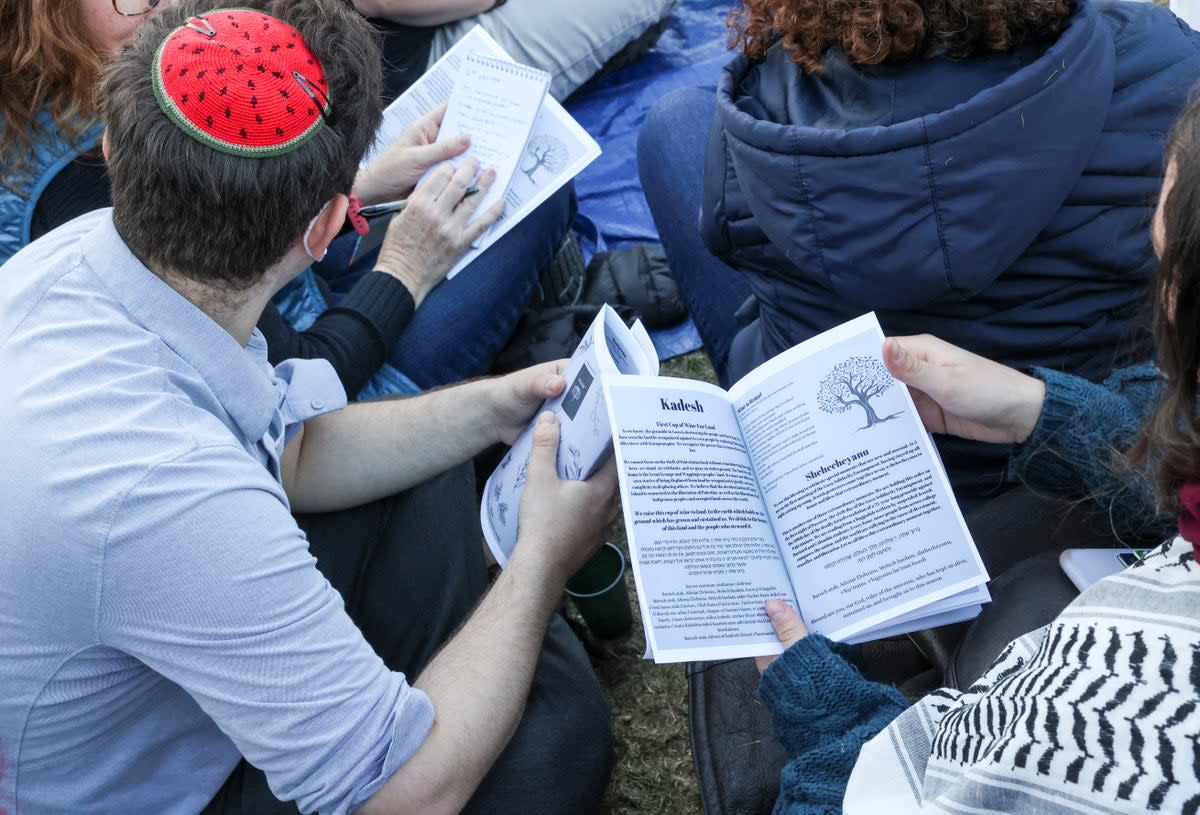 A collective of groups organised by Jewish students at Columbia and Barnard in solidarity with Gaza and the protest encampment host Passover Seder at Columbia University on April 22, 2024 (REUTERS)