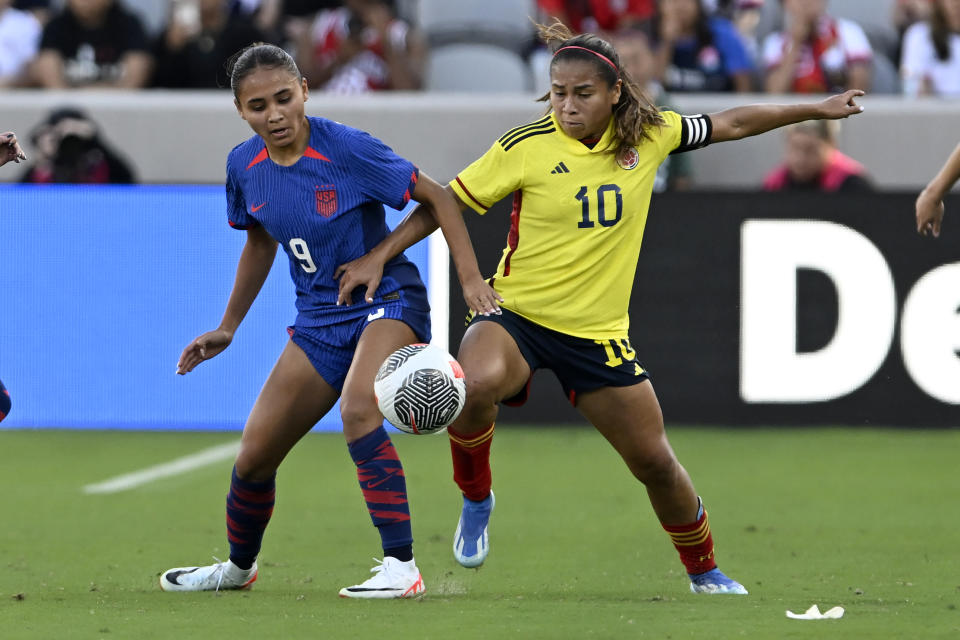 United States forward Alyssa Thompson (9) vies for the ball with Colombia midfielder Leicy Santos (10) during the second half of an international friendly soccer match Sunday, Oct. 29, 2023, in San Diego. (AP Photo/Alex Gallardo)