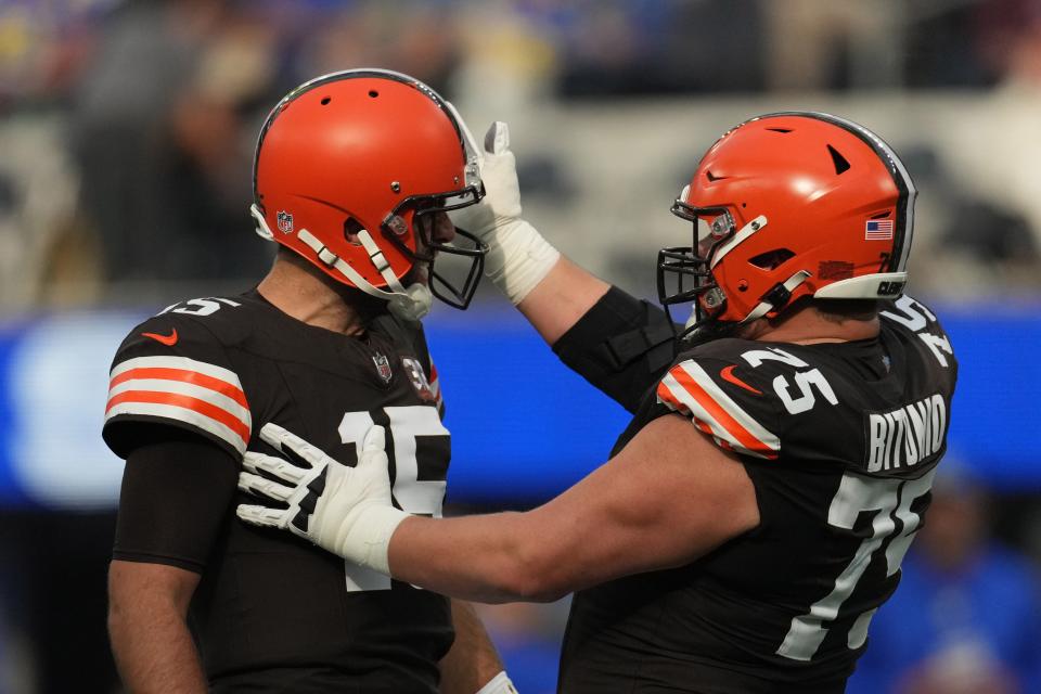 Cleveland Browns quarterback Joe Flacco (15) celebrates with guard Joel Bitonio (75) after a touchdown against the Los Angeles Rams on Sunday in Inglewood, Calif.