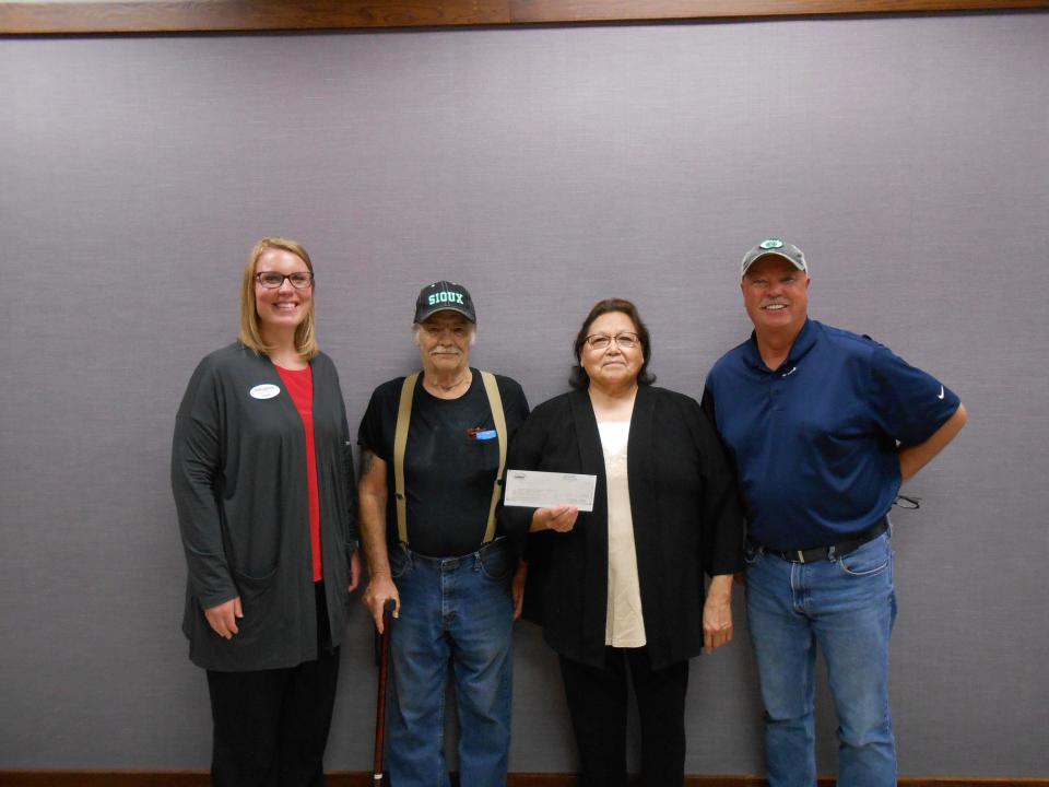 Devils Lake Area Foundation Committee Members Stacey Heggen and Todd Thompson with members from the Native American Guardians Association.
